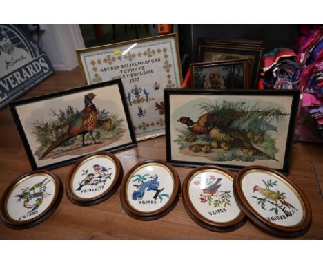 Box of framed needleworks, pheasant print and 1977 alphabet sampler 