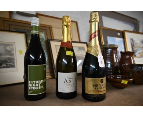 Bottle of Asti, Bottle of German sparkling wine, and bottle of Shiraz 2009