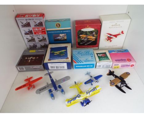 A collection of miniature model aeroplanes to include Schabak, Corgi and others, predominantly mint to near mint, of which ni