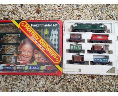 Model Railways - A Hornby OO gauge train set, Freightmaster, comprising diesel electric op no D7063 and 6 goods wagons in ori