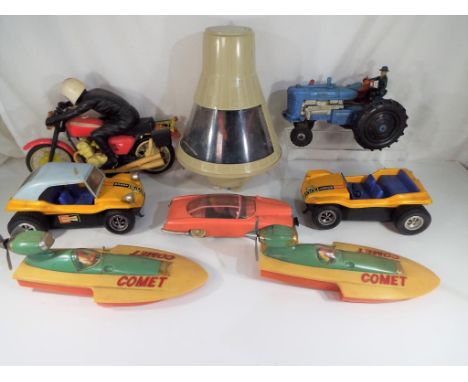 Eight vintage toy vehicles to include two Comet Hydoplane boats by MIC, two HC8 sand buggies, a Thunderbirds FAB1, a Marx Toy