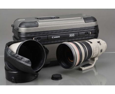 A Canon EF 400mm f/2.8 L IS USM Lens,  serial no 27569, auto focusing functions, barrel P-F, paint wear & scratches, crack to