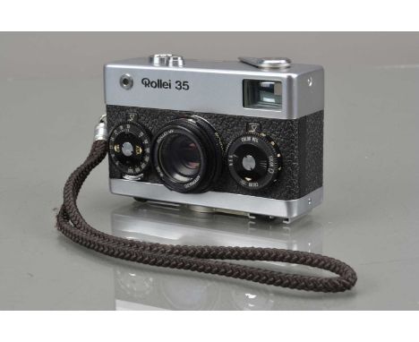 A Rollei 35 Compact Camera, made in Singapore, shutter working, light meter responsive, body G, small ding L/H back bottom co