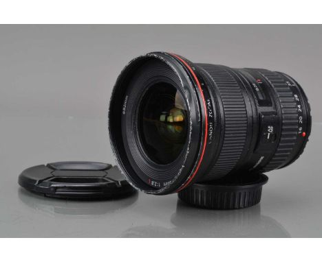 A Canon EF 16-35mm f/2.8 L USM Lens, auto focusing working, barrel F, paint wear & scratches to filter ring, 10mm ding to edg