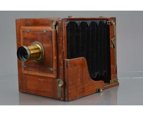 A Mahogany and Brass Half Plate Tailboard Camera, body G, some surface scratches, some tarnishing to brass, bellows G, with u