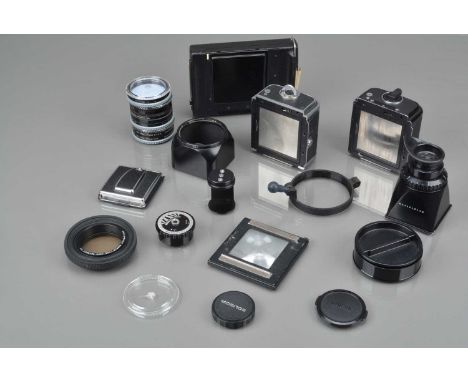 Hasselblad Accessories, a Gossen meter knob, light cell responsive, on 12 back, A16 back, black, some paint wear to edges, bo