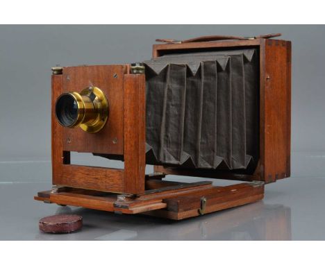 A Mahogany and Brass Quarter Plate Camera, restored, body G, bellows F, with waterhouse stop lens, marked Wood Late Abraham 1