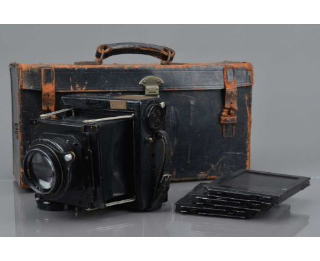 A Soho 4¾ x 3¾'' Press Camera, strut camera, serial no M5740, body G, bellows G, shutter jammed, curtain missing, with Dallme