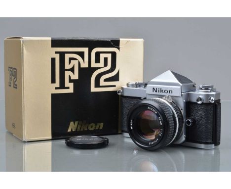 A Nikon F2 SLR Camera, chrome, serial no 7612281, shutter working, self timer working, body VG, with Nikkor 50mm f/1.4 Ai len