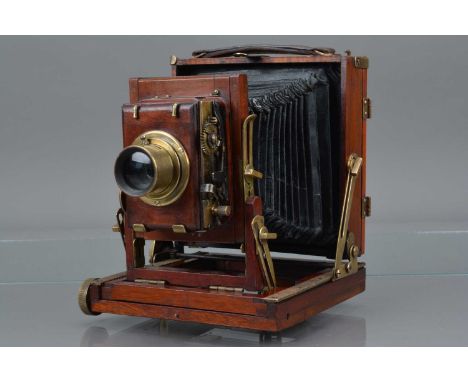 A Thornton Pickard College Quarter Plate Mahogany & Brass Camera, body G, solder repair to back focusing wheel, bellows P. wi