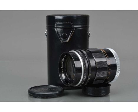 A Canon Super-Canomatic R 100mm f/2 Lens, serial no 12282, barrel G, paint wear to grips, elements F-G, light scratches, dust