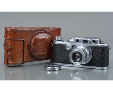 A Leitz Wetzlar Leica IIIa Model G Rangefinder Camera, chrome, serial no 304575, 1938, shutter working, rangefinder working, 