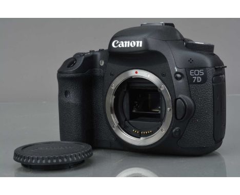 A Canon EOS 7D DSLR Camera Body, shutter working, appears to function as should, body VG, with battery, LG-E6E charger, body 