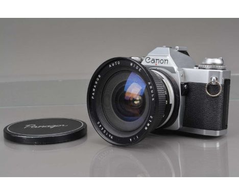 A Canon AV-1 SLR Camera, serial no 1507268, shutter working, camera responsive in auto, self timer working, body G, with Pana