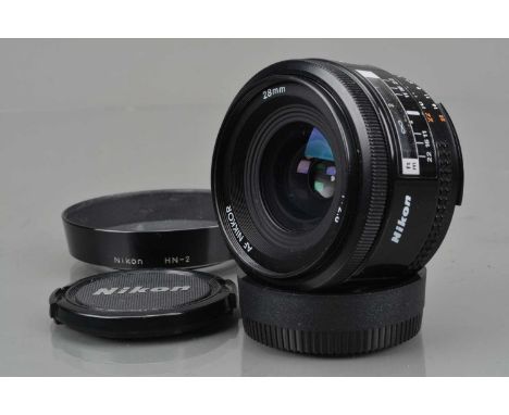 A Nikon AF Nikkor 28mm f/2.8 Lens, auto focus working, barrel G, elements G-VG, with HN-2 hood, front and rear caps