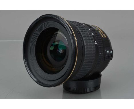 A Nikon DX AF-S Nikkor 12-24mm f/4 ED IF Lens, serial no 206161, auto focusing working, barrel G, focus grip slightly tacky, 