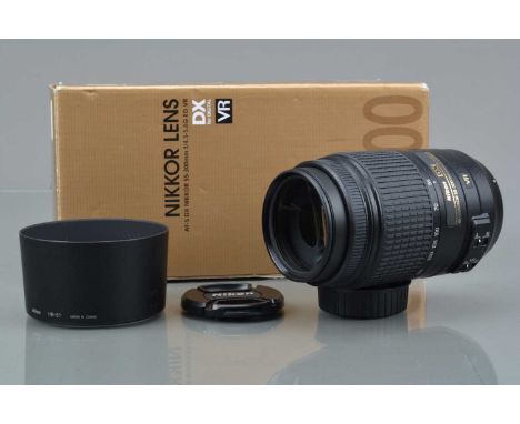 A Nikon AF-S DX Nikkor 55-300mm f/4.5-5.6G ED VR Lens, serial number 2185872, auto focus working, barrel VG, elements VG, wit