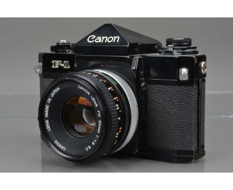 A Canon F-1 SLR Camera, serial no 252365, shutter working, meter working, self timer working, body G, some brassing to edges,