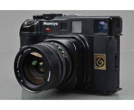 A Mamiya 6 Rangefinder Camera, serial no 307797, shutter working, meter responsive, self timer working, body G, some small de