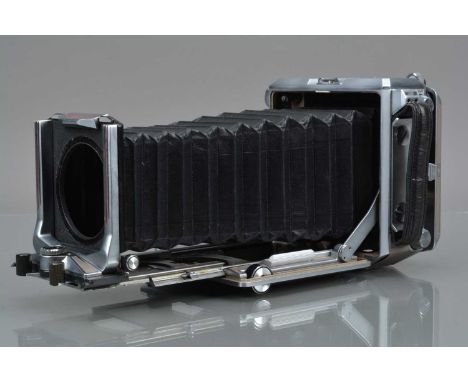 A Linhof Technika 6.5 x 9cm Camera Body, serial no 4990. no rangefinder attached, all moves freely, body G-VG, bellows G