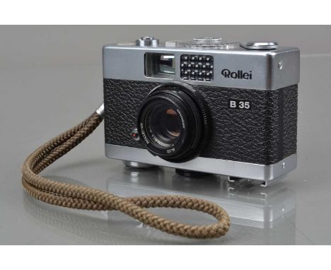 A Rollei B 35 Compact Camera, made in Singapore, shutter working, light cell responsive, body G-VG, with Carl Zeiss Triotar 4