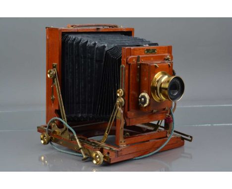 A Thornton Pickard Victo Triple Extension Half Plate Mahogany and Brass Camera,  body G-VG, bellows G, with Beck f/8 Symmetri