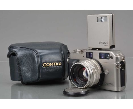 A Contax G1 Camera, shutter working, camera responsive in settings, body G-VG, with Carl Zeiss T* 45mm f/2 Planar lens, auto 