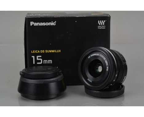 A Panasonic H-X015 Lumix G Leica DG Summilux 15mm f/1.7 ASPH Lens, focusing working, barrel VG, elements VG-E, with H-X-015 h