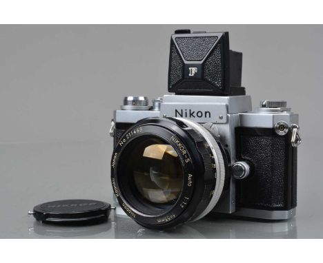 A Nippon Kogaku Nikon F SLR Camera, chrome, serial no 6704651, shutter working, self timer working, body G-VG, light marks to