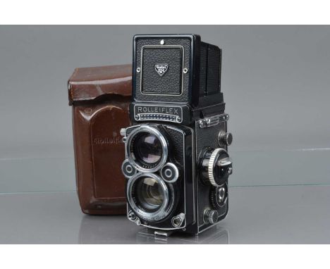 A Rolleiflex 2.8F TLR Camera, serial no 2445831, shutter working, light cell working, body G, some lifting to leatherette on 