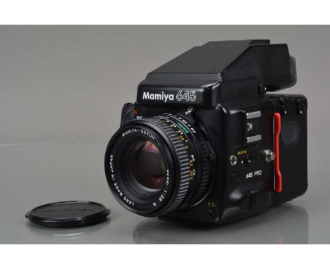 A Mamiya 645 Pro Camera, serial no PH1568, shutter working, body G, some light marks to base, with AE Prism Finder, meter res