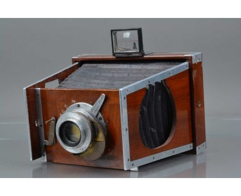 A Shew Co Aluminium Xit Half Plate Camera, mahogany & aluminium, body G, no makers plate, bellows G, shutter working, with Ro