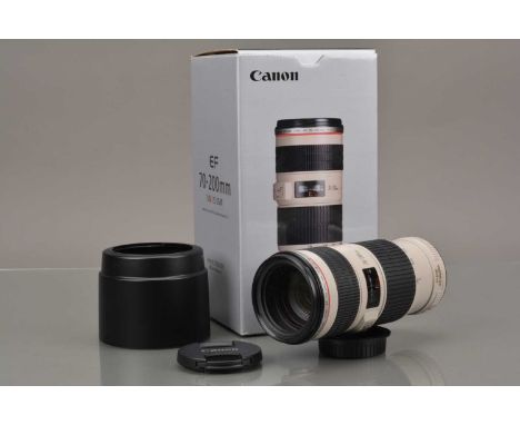 A Canon EF 70-200mm f/4 L IS USM Lens, serial no 603469, auto focus working, barrel VG, elements VG-E, with front & rear caps