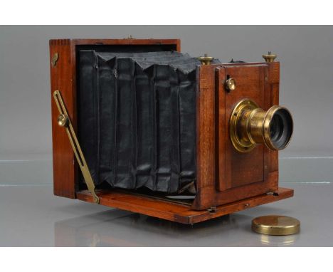 An E & T Underwood Mahogany & Brass Half Plate Camera, body G, body G, bellows P, with f/8 lens, barrel G, some tarnishing, e