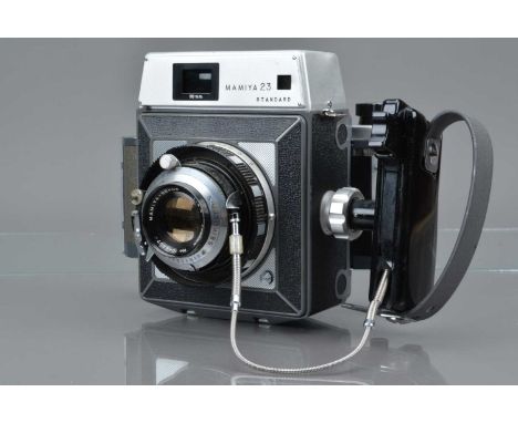 A Mamiya 23 Standard Camera, serial no 2864873, rangefinder working, body G, ding to L/H corner of top plate, with Mamiay Sek