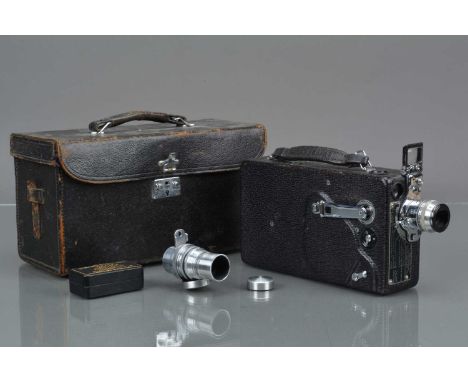 A Cine Kodak Model K 16mm Cine Camera, motor runs, body G, some light wear, with 25mm f/1.9 Kodak Anastigmat lens and 3in f/4