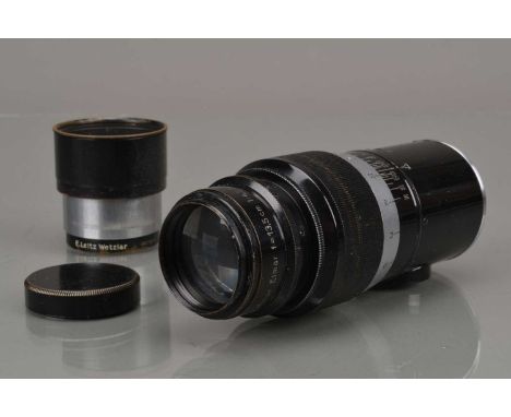 A Leitz Wetzlar 13.5cm f/4.5 Elmar Lens, black/chrome, serial no 1971181, barrel G, some light brassing to focus grip, elemen