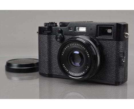 A Fujifilm X100 F Digital Camera, black, powers up, shutter working, display working, camera appears to function as should, b