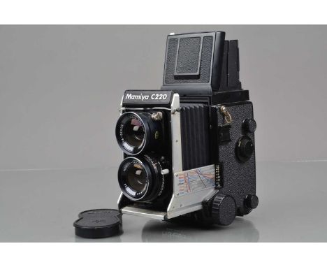 A Mamiya C220 Professional F TLR Camera,  serial no W 107628, body G, some light paint wear to edges, bellows G-VG, with Mami