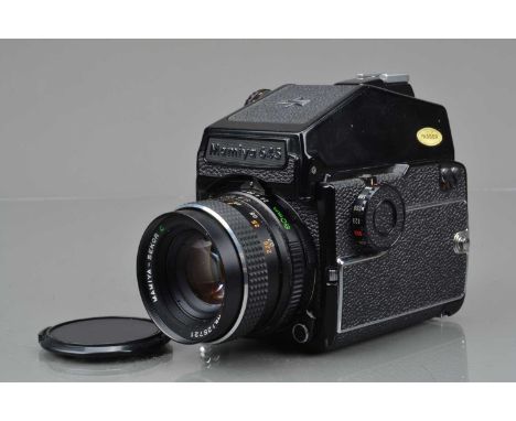 A Mamiya M645 1000S Camera, serial no L 66430, shutter working, body G-VG, some light wear, with AE Prism finder, finder resp