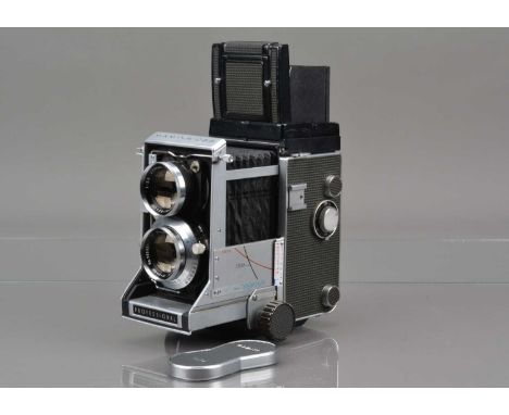 A Mamiya C33 Professional TLR Camera, serial no 302338, body G, some light scratches to viewfinder edges, bellow G, with Mami