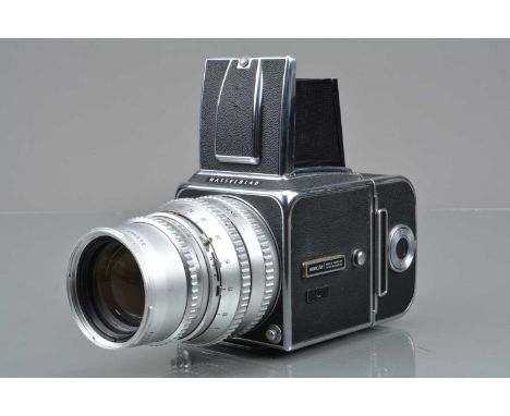 A Hasselblad 500C/M Camera,  chrome, serial no UC 166111, body G, slight wear, with Carl Zeiss 150mm f/4 Sonnar lens, serial 