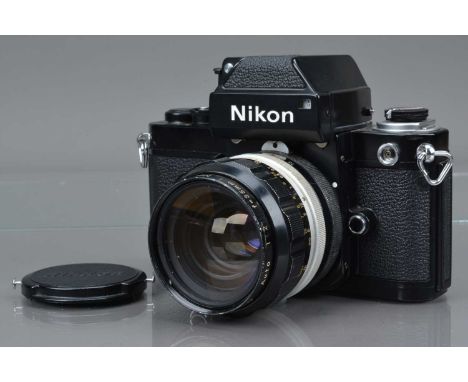 A Nikon F2 SLR Camera, black, serial no 7434603, shutter working, self timer working, body G-VG, with DP-1 finder, meter work