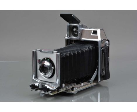 A Linhof Super Technika IV 6 x 9 Camera. serial no 84989, all moves freely, rangefinder working, body G, bellows G, with Schn