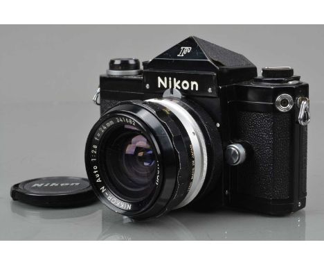 A Nikon F SLR Camera, black, serial no 6878361, shutter working, self timer working, body G, some light brassing to finder ed