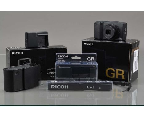 A Ricoh GR2 Digital Camera, black, serial no XV14101803, shutter count 1.979, powers on, shutter working, flash working, disp