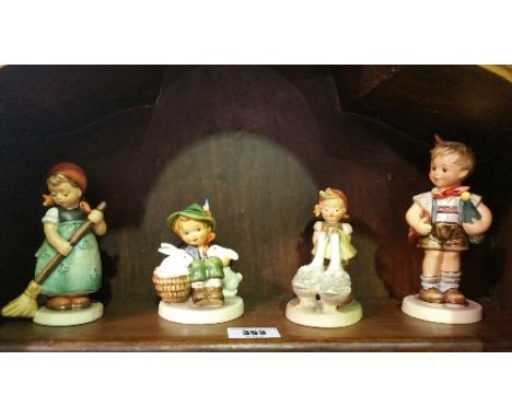 A Shelf of Goebel Figures.