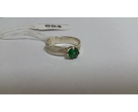 A Ladies Green Stone Ring  in a Silver Coloured Band, (Vendor Paid €100).