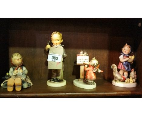 A Shelf of Goebel Figures.