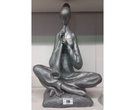 A Figure of a Woman Playing a Musical Instrument, 17" high.